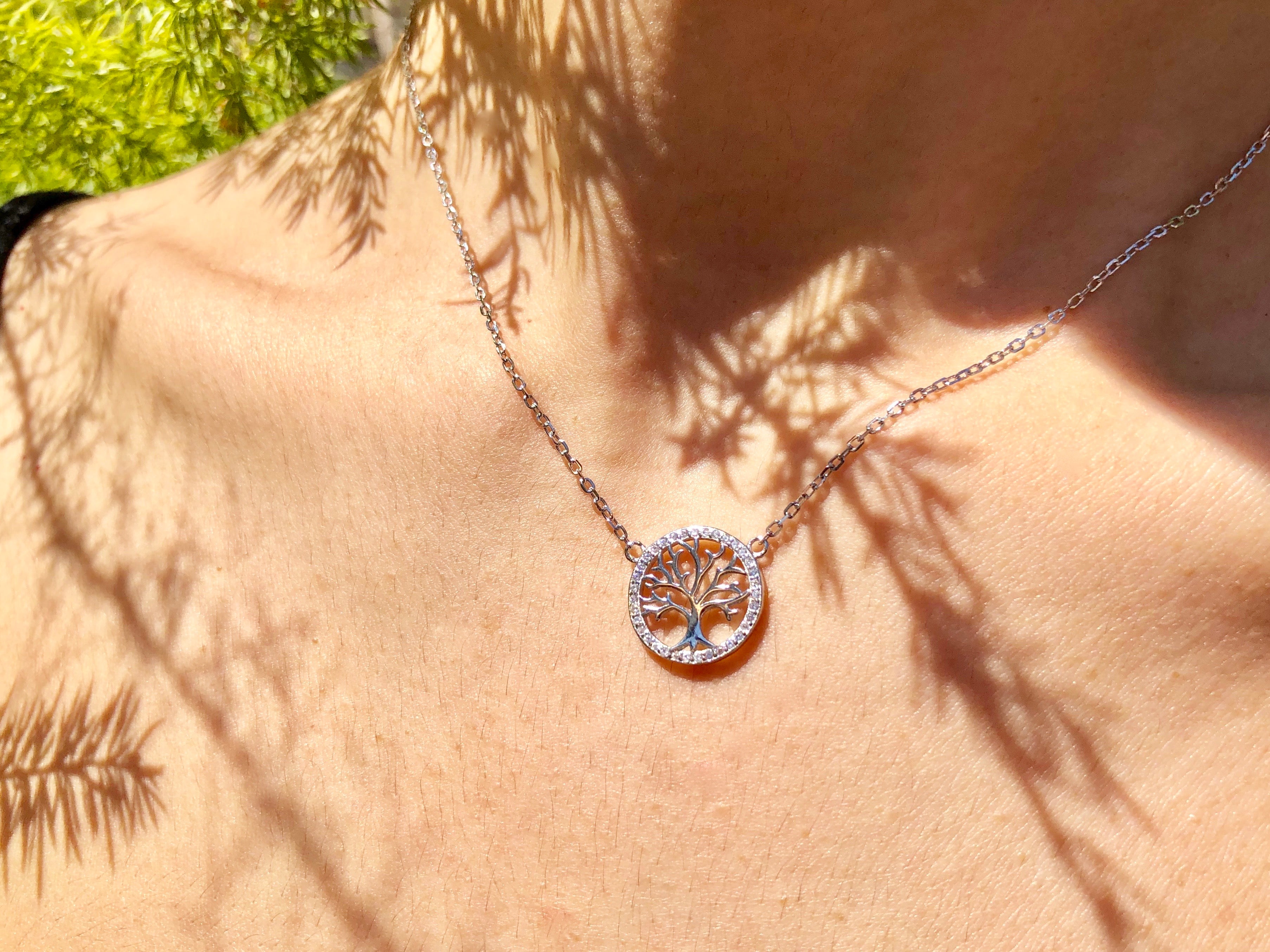 Ode to wellness, our elegant pendant featuring a Tree of Life charm, crafted in solid 925 Sterling silver and plated in white-gold.   Material: Sterling Silver Plating: White-gold plated 