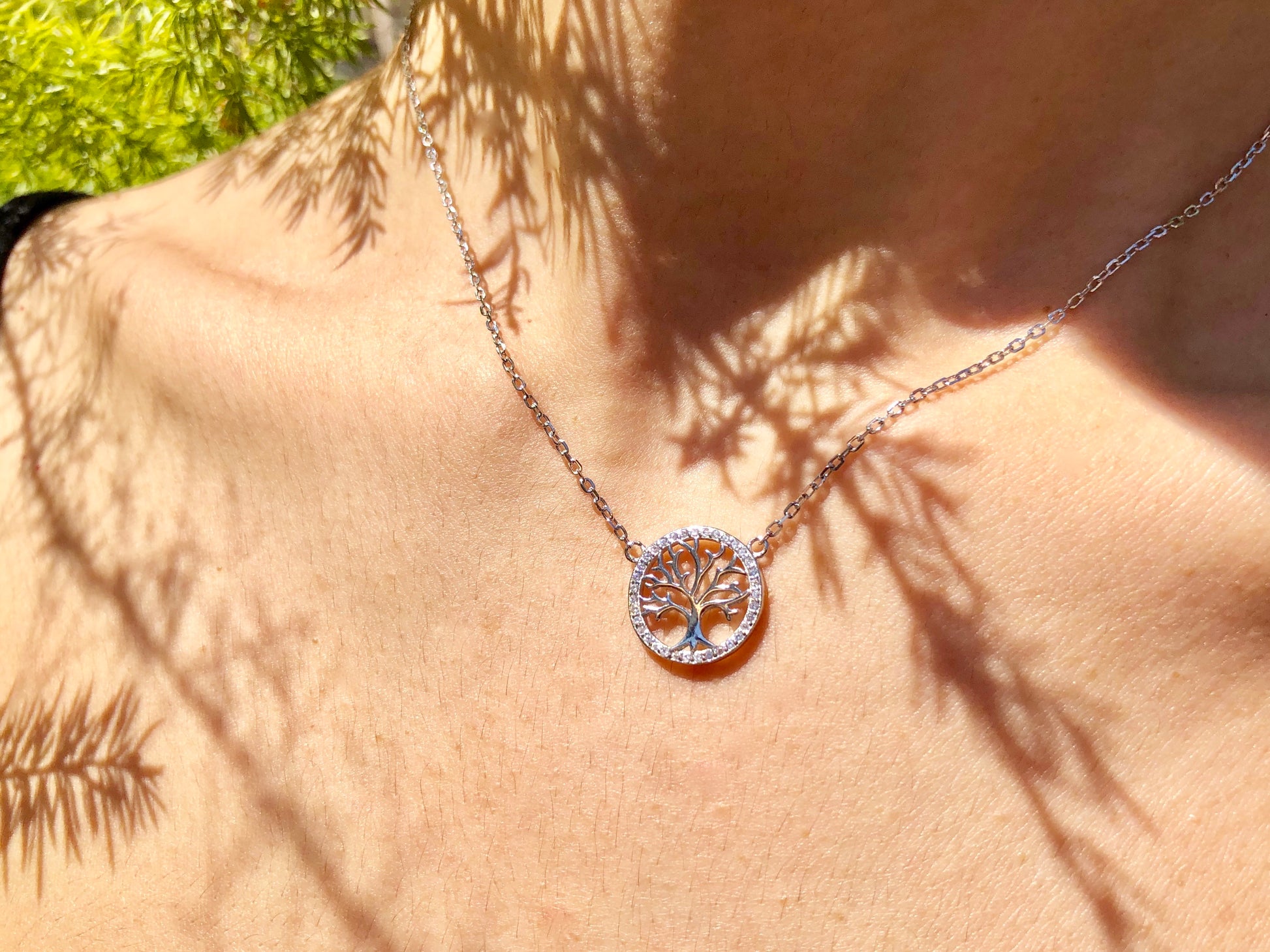 Ode to wellness, our elegant pendant featuring a Tree of Life charm, crafted in solid 925 Sterling silver and plated in white-gold.   Material: Sterling Silver Plating: White-gold plated 